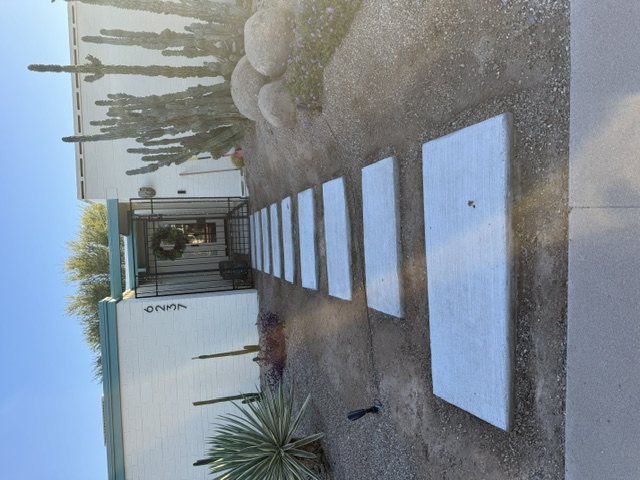Front entry walkway with concrete pavers, yucca and saguaro cactus